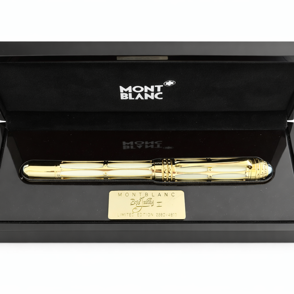 Gold pen in a black Montblanc box on a white background
