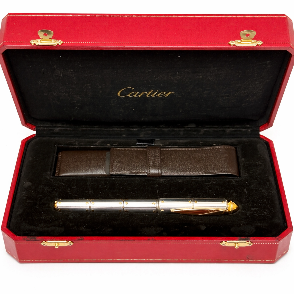 Cartier pen in a red and gold case on a white background