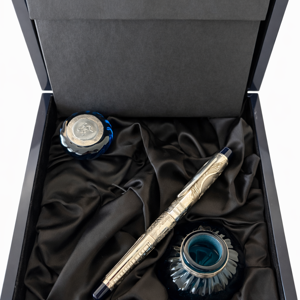 Ink pen set with inkwells in a black box